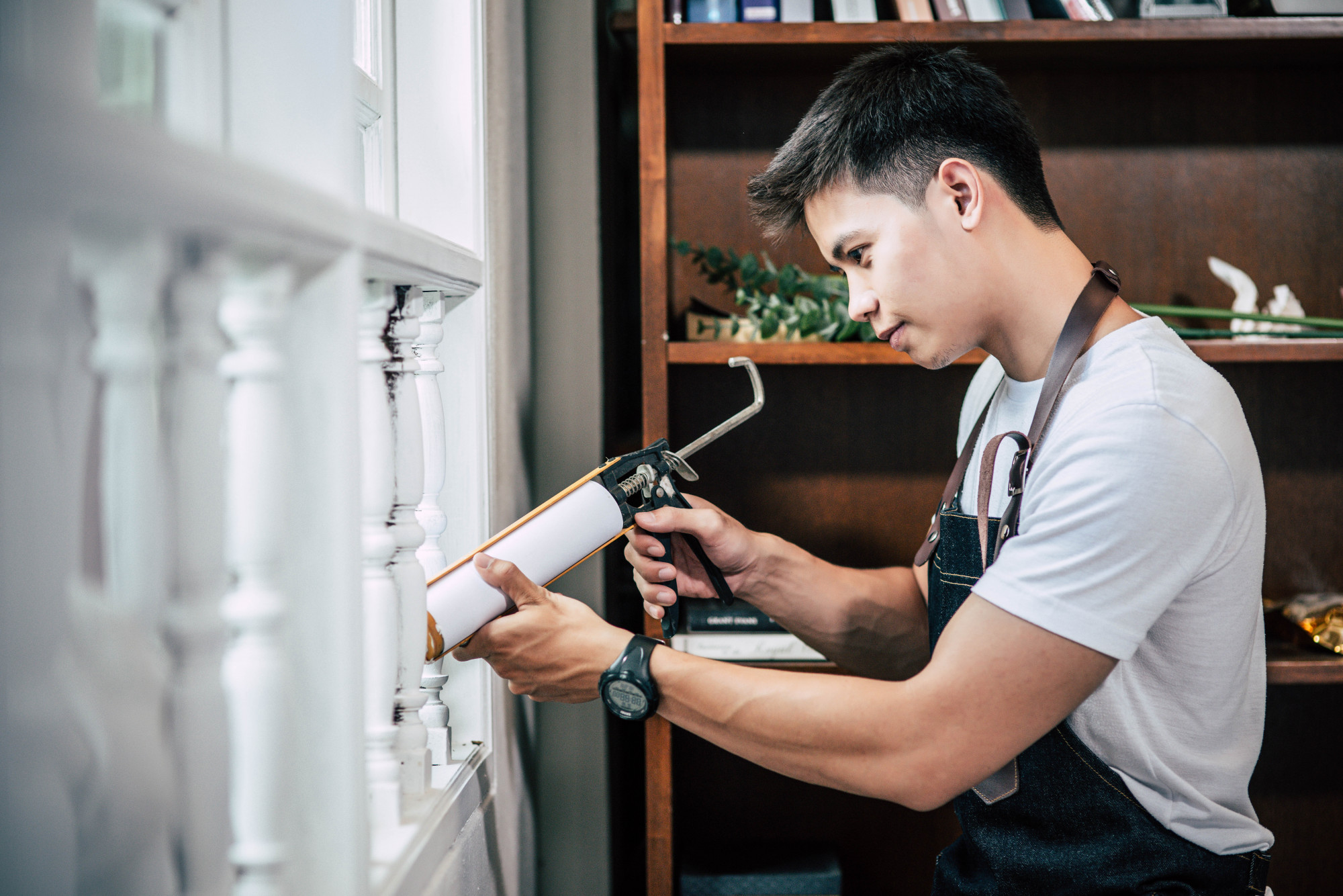 Professional working on balcony maintenance