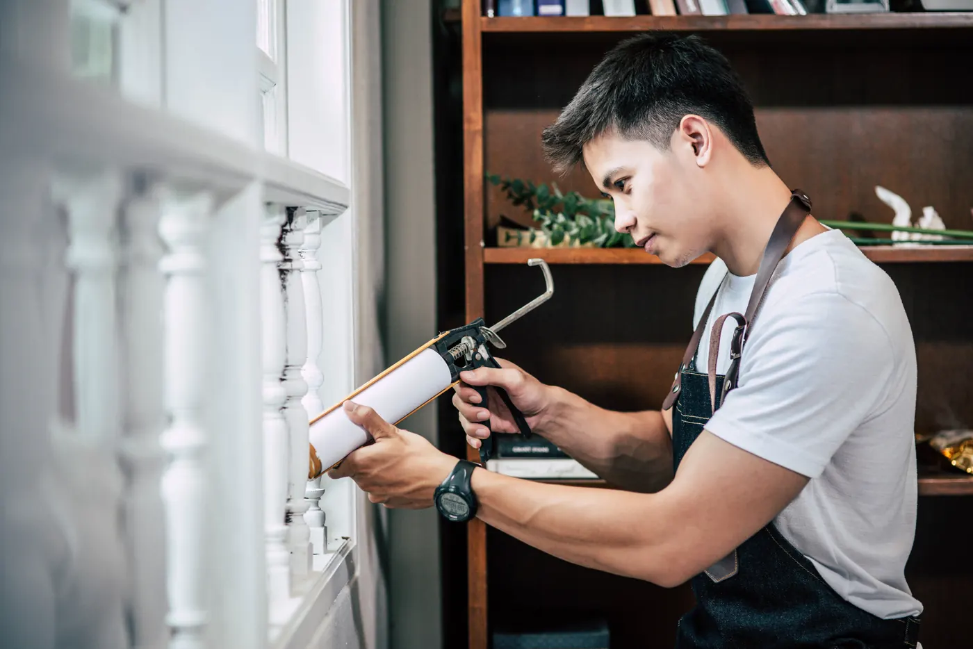 Professional working on balcony maintenance