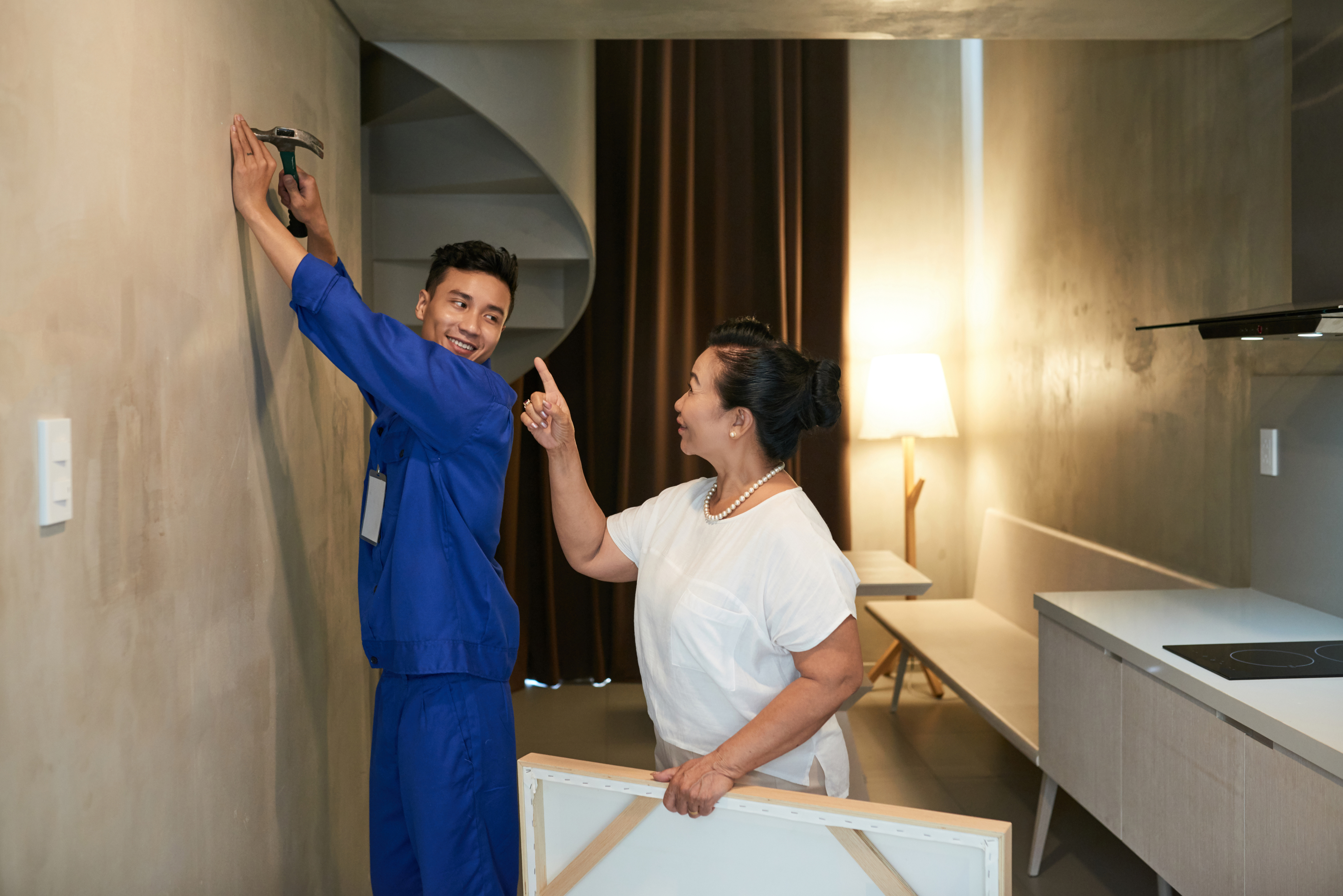 Professional putting paint on wall